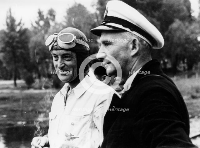 Sir Malcolm Campbell, on the left, possibly at Coniston, 1939. Artist: Unknown