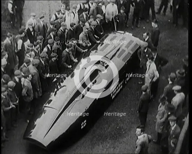 Sir Henry Segrave AKA Major Segrave's Car 'Sunbeam' Being Pushed By a Crowd of Civilians, 1927. Creator: British Pathe Ltd.