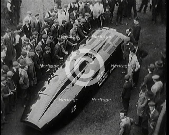 Sir Henry Segrave AKA Major Segrave's Car 'Sunbeam' Being Pushed By a Crowd of Civilians, 1927. Creator: British Pathe Ltd.