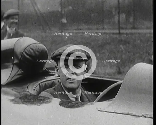 Sir Henry Segrave AKA Major Segrave's Climbing Into 'Sunbeam' Watched By a Crowd of Civilians, 1927. Creator: British Pathe Ltd.