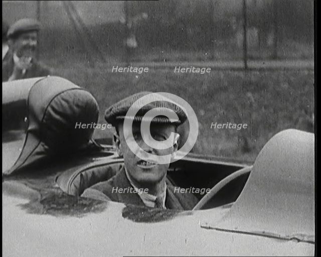 Sir Henry Segrave AKA Major Segrave's Climbing Into 'Sunbeam' Watched By a Crowd of Civilians, 1927. Creator: British Pathe Ltd.