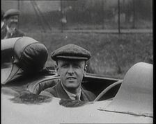 Sir Henry Segrave AKA Major Segrave's Climbing Into Sunbeam Watched By a Crowd of Civilians, 1927. Creator: British Pathe Ltd