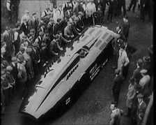 Sir Henry Segrave AKA Major Segrave's Car Sunbeam Being Pushed By a Crowd of Civilians, 1927. Creator: British Pathe Ltd