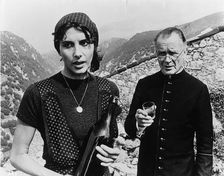 Sir John Mills (1908-), British actor, and Paola Pitagora (1942- ), Italian actress, 1977