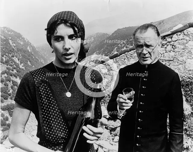 Sir John Mills (1908-), British actor, and Paola Pitagora (1942- ), Italian actress, 1977. Creator: Unknown.