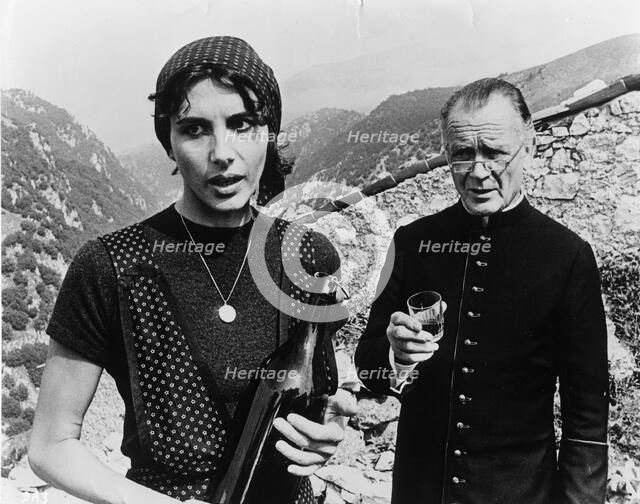 Sir John Mills (1908-), British actor, and Paola Pitagora (1942- ), Italian actress, 1977. Artist: Unknown