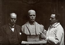 Sir Ronald Ross standing next to a bust of himself, and Janko Bragovitch (sculptor), 1926. Creator: Grove, Son and Boulton