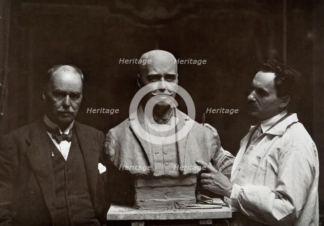 Sir Ronald Ross standing next to a bust of himself, and Janko Bragovitch (sculptor), 1926. Creator: Grove, Son and Boulton.