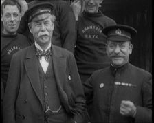 Sir Thomas Lipton Standing With the Crew of the Ship The Shamrock 1920. Creator: British Pathe Ltd