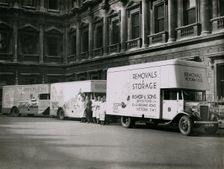 Sir Walter Lamb with vans and staff from Bishop & Sons Depositories outside Burlington House, 1935. Creator: Topical Press Agency
