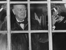 Sir Winston Churchill waving from his Hyde Park Gate window on his 89th birthday, 1963