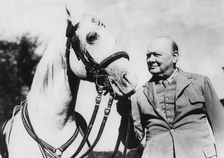 Sir Winston Churchill with one of Bernard Van Leer's circus horses at Chartwell, Kent, 1946 Creator: Unknown