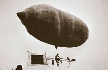 Sky cycle below a balloon, early 1900s. Creator: Unknown