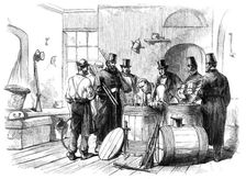 Sketches from Ireland: opening casks of arms at the Dublin Steam-Ship Company's stores..., 1870. Creator: Unknown