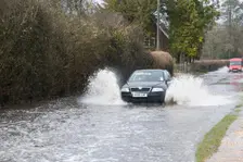 Skoda driving fast through floodwater at Beaulieu 2008