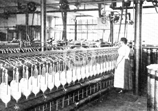 Slubbing, during which the slivers are drawn out still more, and are wound on bobbins, 1909.  Creator: Unknown.