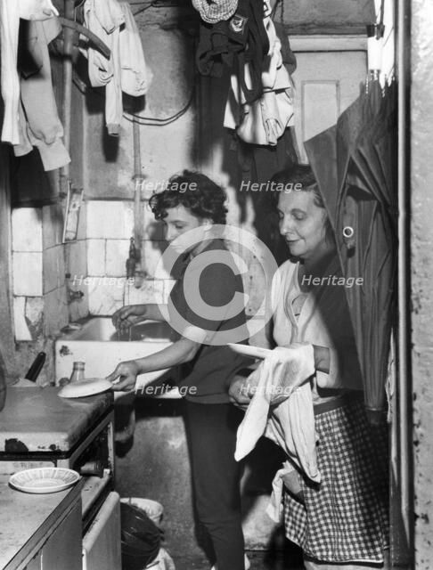 Slum dwelling in London's East End, 1965. Artist: EH Emanuel
