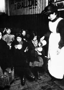 Slum sister giving out farthing breakfast, London