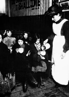 Slum sister giving out farthing breakfast, London. Creator: Unknown