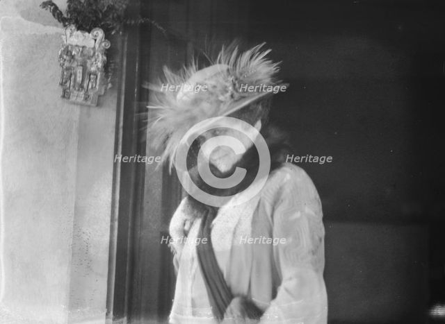 Slater, Mrs., standing by the door of a house in Long Beach, 1924 July. Creator: Arnold Genthe.