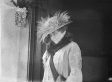 Slater, Mrs., standing by the door of a house in Long Beach, 1924 July. Creator: Arnold Genthe