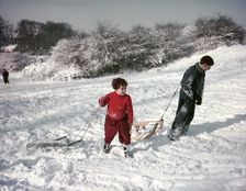 Sledging on Hampstead Heath, London, c1955. Creator: Arthur Charles Kirby Ware