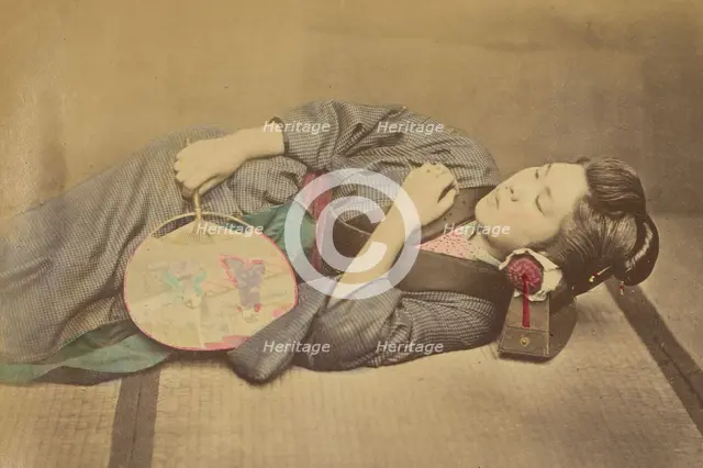 Sleeping Japanese woman holding a fan, 1868-1880. Creator: Felice Beato.