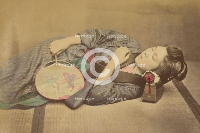 Sleeping Japanese woman holding a fan, 1868-1880. Creator: Felice Beato.