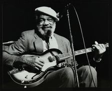Slim Gaillard playing his guitar at the Forum Theatre, Hatfield, Hertfordshire, 13 November 1986. Artist: Denis Williams
