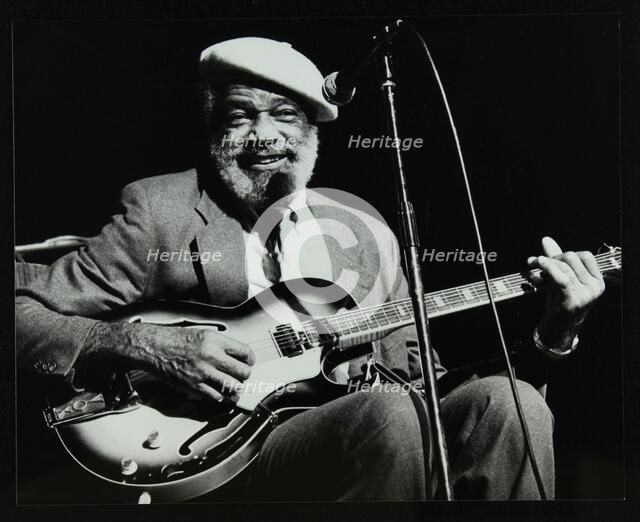 Slim Gaillard playing his guitar at the Forum Theatre, Hatfield, Hertfordshire, 13 November 1986. Artist: Denis Williams