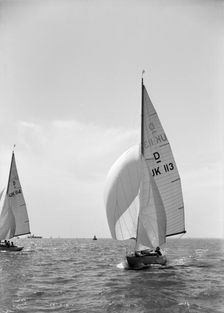 Sloop (Dragon? class) sailing with spinnaker, c1938. Creator: Kirk & Sons of Cowes