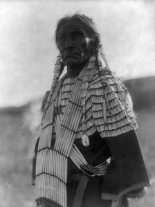 Slow Bull's wife, c1907. Creator: Edward Sheriff Curtis