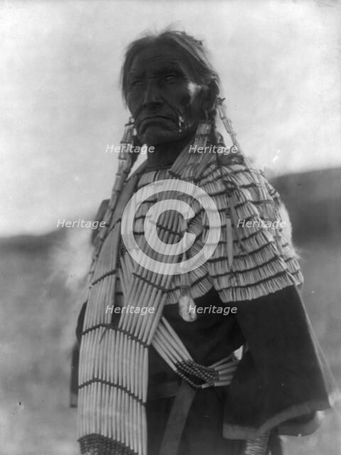 Slow Bull's wife, c1907. Creator: Edward Sheriff Curtis.