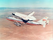 Space Shuttle Orbiter mounted on top of a Boeing 747 carrier aircraft, 1977. Creator: Unknown