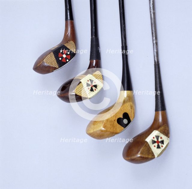 Spalding wooden clubs with coloured 'Fancy Face' inserts, American, 1920s. Artist: Spalding