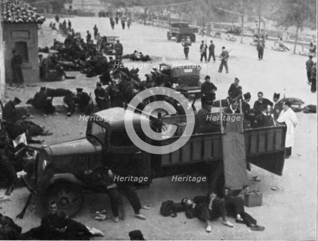 Spanish Civil War 1936-39. Madrid, Red Cross post with doctors and nurses, in a city street, Dece…