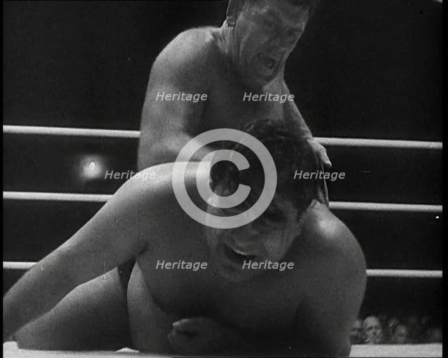 Spectators Watching a Wrestling Match, 1930s. Creator: British Pathe Ltd.