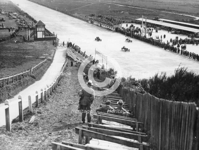 Spectators watching motor racing from the Test Hill, Brooklands, Surrey, (1920s?). Artist: Unknown