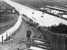 Spectators watching motor racing from the Test Hill, Brooklands, Surrey, (1920s?)