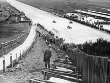 Spectators watching motor racing from the Test Hill, Brooklands, Surrey, (1920s?)