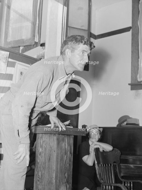 Speaker, migratory worker, Conference to Aid Agricultural Organization, Bakersfield, CA, 1938. Creator: Dorothea Lange.