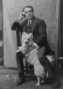 Spirescu, Steraskon, Mr., with dog, portrait photograph, 1917 Mar. 1. Creator: Arnold Genthe