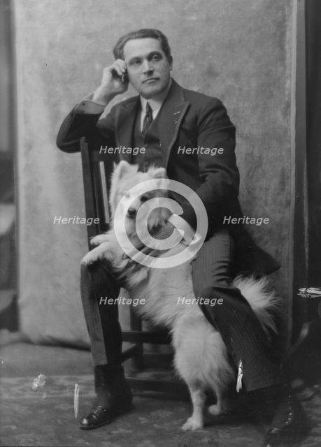Spirescu, Steraskon, Mr., with dog, portrait photograph, 1917 Mar. 1. Creator: Arnold Genthe.
