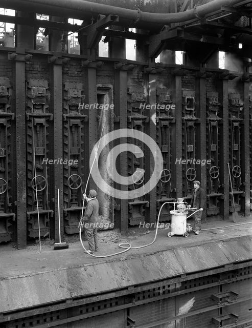 Spraying refractory linings at Manvers coking works, near Rotherham, South Yorkshire, 1963. Artist: Michael Walters