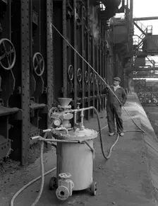 Spraying the ovens at Manvers coking works near Rotherham, South Yorkshire, 1963. Creator: Michael Walters