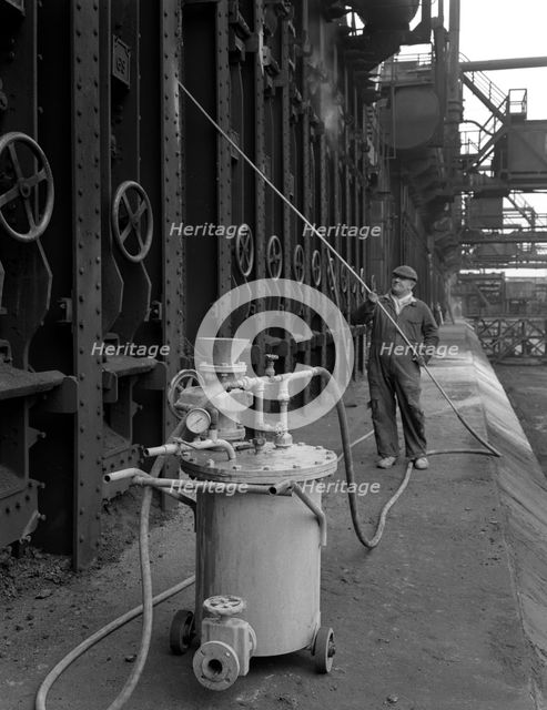 Spraying the ovens at Manvers coking works near Rotherham, South Yorkshire, 1963. Artist: Michael Walters