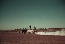 Spreading fertilizer from 4-mule team wagon, Georgia, ca. 1940. Creator: Marion Post Wolcott
