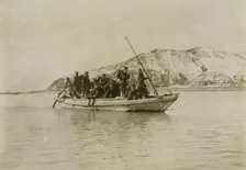 Squad of sappers and miners coming ashore in a sampan at Chemulpo, c1904. Creator: Robert Lee Dunn