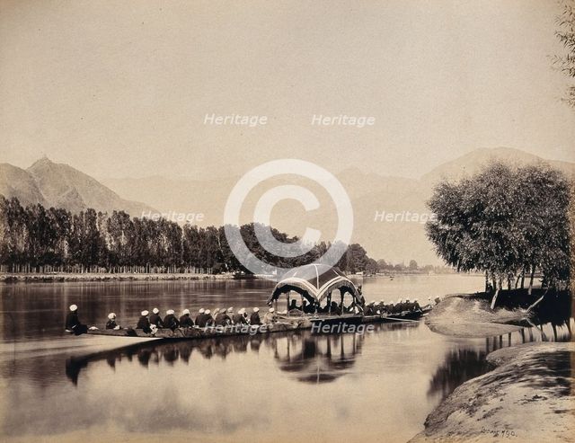 Srinagar, Kashmir: a large rowing boat proceeding along an inland waterway, c1870s. Creator: Samuel Bourne.