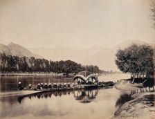 Srinagar, Kashmir: a large rowing boat proceeding along an inland waterway, c1870s. Creator: Samuel Bourne